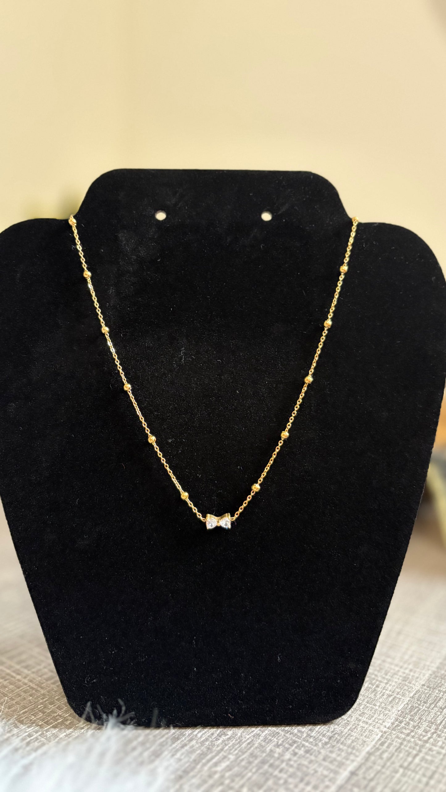 Bow charm necklace
