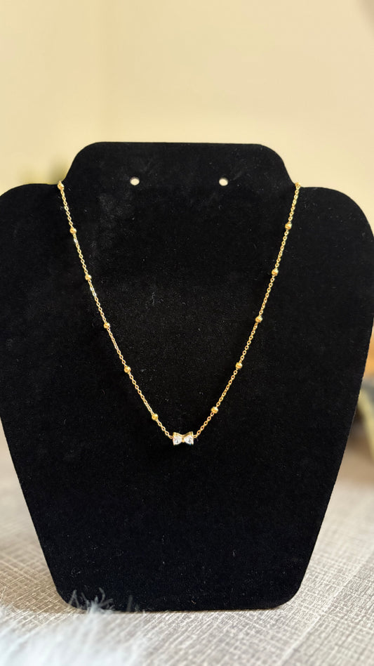 Bow charm necklace